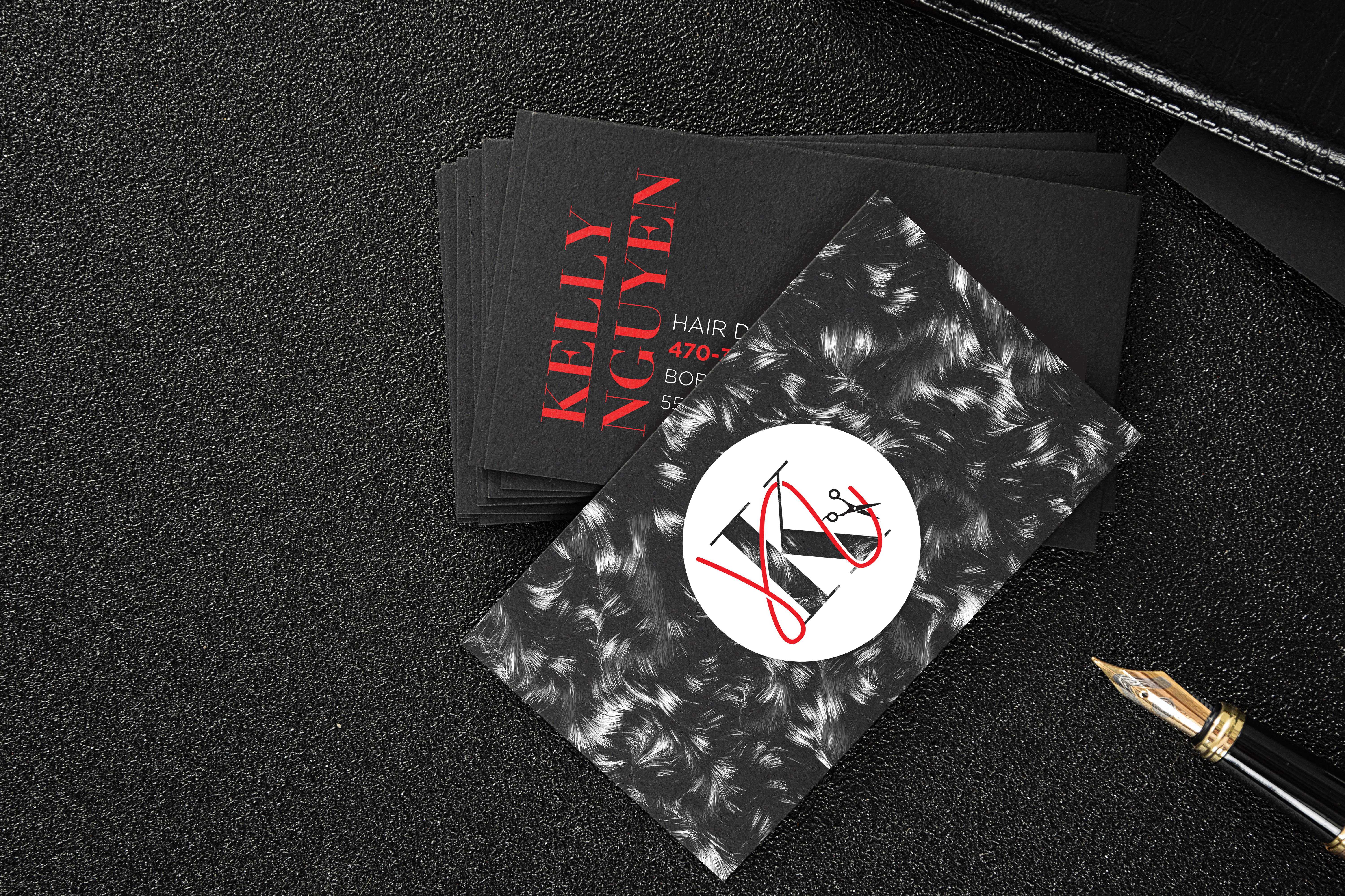 Kelly Nguyen business card — black matte with hair texture pattern and red type